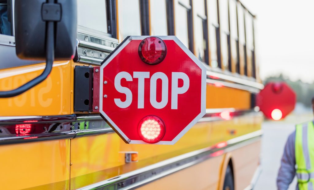 school bus flashing stop sign